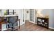 Inviting office with hardwood floors, a desk, a chair, and ample natural light at 7604 Derek Dr, Raleigh, NC 27613