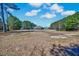 Aerial view of property showing the brick home, lush greenery, and surrounding landscape at 7687 Mattie Rd, Rocky Mount, NC 27803