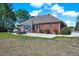 Brick home with screened-in porch, patio, swing and large backyard at 7687 Mattie Rd, Rocky Mount, NC 27803