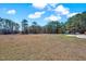Expansive backyard with grassy lawn at 7687 Mattie Rd, Rocky Mount, NC 27803