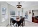 Inviting breakfast nook with modern light fixture, natural light and an adjacent doorway at 7687 Mattie Rd, Rocky Mount, NC 27803
