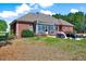 Brick home with screened-in porch, patio and backyard at 7687 Mattie Rd, Rocky Mount, NC 27803