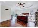 Spacious main bedroom showcasing tray ceilings, hardwood floors, and ample natural light at 7687 Mattie Rd, Rocky Mount, NC 27803