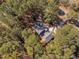 Aerial view of a home with mature trees providing shade and privacy at 7917 Blaney Franks Rd, Apex, NC 27539