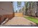 Home's backyard area with gravel and wood barrier at 7917 Blaney Franks Rd, Apex, NC 27539