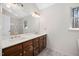 Bathroom with double sink and a large mirror at 7917 Blaney Franks Rd, Apex, NC 27539