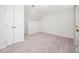 This bedroom provides a large closet and features neutral walls and plush carpet at 7917 Blaney Franks Rd, Apex, NC 27539