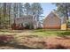 Home's backyard with lawn and trees at 7917 Blaney Franks Rd, Apex, NC 27539