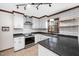 Updated kitchen with stainless steel appliances, white cabinets, and a modern subway tile backsplash at 7917 Blaney Franks Rd, Apex, NC 27539