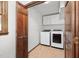 Laundry room features a washer, dryer, and a door to the left at 7917 Blaney Franks Rd, Apex, NC 27539