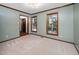 Living room with light blue walls and tan carpet at 7917 Blaney Franks Rd, Apex, NC 27539