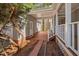 Inviting brick path leading to a covered porch, offering a charming entrance to the home at 7917 Blaney Franks Rd, Apex, NC 27539