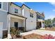 Inviting townhome exterior features a clean, bright facade with manicured landscaping at 803 Toulouse Ct, Cary, NC 27519