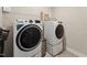 Well-equipped laundry room featuring a modern washer and dryer set for convenient chores at 803 Toulouse Ct, Cary, NC 27519
