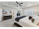 Serene main bedroom featuring a ceiling fan, plush carpet, and a TV at 803 Toulouse Ct, Cary, NC 27519