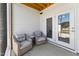 Cozy outdoor patio with seating and double doors at 803 Toulouse Ct, Cary, NC 27519