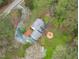 Aerial view of a home features a long driveway and outdoor fire pit at 8504 Old Nc 86, Chapel Hill, NC 27516