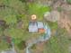 Aerial view of house and surrounding landscape showcasing the pool and firepit at 8504 Old Nc 86, Chapel Hill, NC 27516
