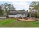 Spacious backyard with custom fire pit and seating area offers a tranquil outdoor retreat at 8504 Old Nc 86, Chapel Hill, NC 27516