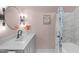 Charming bathroom with a modern vanity, elegant light fixtures, and a stylish shower curtain at 8504 Old Nc 86, Chapel Hill, NC 27516