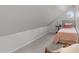 Cozy attic bedroom with carpet, dormer window, and angled ceilings at 8504 Old Nc 86, Chapel Hill, NC 27516