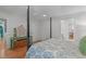 Charming bedroom featuring a four-poster bed, hardwood floors, and stylish decor at 8504 Old Nc 86, Chapel Hill, NC 27516