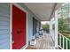 Inviting front porch with rocking chairs enhances the home's curb appeal at 8504 Old Nc 86, Chapel Hill, NC 27516