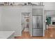 Bright kitchen featuring stainless steel appliances, hardwood floors, and ample cabinet storage at 8504 Old Nc 86, Chapel Hill, NC 27516