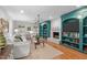 Inviting living room with a cozy fireplace, built-in shelving, and comfortable seating at 8504 Old Nc 86, Chapel Hill, NC 27516