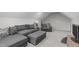 Cozy living room boasts gray furniture, carpet, and neutral walls at 8504 Old Nc 86, Chapel Hill, NC 27516