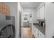 Spacious butler's pantry with gray cabinets, stainless steel appliances, and an adjoining kitchen at 8504 Old Nc 86, Chapel Hill, NC 27516