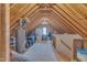 Spacious attic with wooden beams, ample storage, and natural light at 8704 Paddle Wheel Dr, Raleigh, NC 27615
