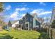 The spacious backyard has a great lawn area and wooden privacy fence at 8704 Paddle Wheel Dr, Raleigh, NC 27615