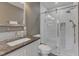 Stylish bathroom features a walk-in shower with sleek glass doors and granite countertop vanity at 8704 Paddle Wheel Dr, Raleigh, NC 27615