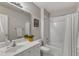 Well-lit bathroom featuring a large mirror, vanity, and a shower with a tub at 8704 Paddle Wheel Dr, Raleigh, NC 27615