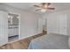 Comfortable bedroom with hardwood floors, natural light, and ensuite bathroom access at 8704 Paddle Wheel Dr, Raleigh, NC 27615