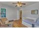 Comfortable Bedroom featuring a glider, crib, and a closet with ample storage at 8704 Paddle Wheel Dr, Raleigh, NC 27615