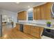Bright kitchen with light wood cabinets and stainless steel dishwasher at 8704 Paddle Wheel Dr, Raleigh, NC 27615