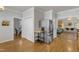 Open kitchen with stainless steel refrigerator and hardwood flooring at 8704 Paddle Wheel Dr, Raleigh, NC 27615