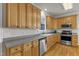 Charming kitchen with light wood cabinets and modern appliances at 8704 Paddle Wheel Dr, Raleigh, NC 27615