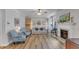 Inviting living room with a fireplace, hardwood floors, and comfortable seating at 8704 Paddle Wheel Dr, Raleigh, NC 27615