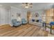 Comfortable living room featuring a neutral sofa and hardwood floors at 8704 Paddle Wheel Dr, Raleigh, NC 27615