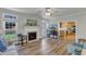 Cozy living room with a fireplace and a view to the kitchen at 8704 Paddle Wheel Dr, Raleigh, NC 27615