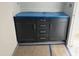 Bathroom cabinet with dark wood and silver hardware with a light countertop at 908 Colfax St, Durham, NC 27701