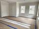 Bright bedroom features natural light, fresh paint, and ready for new flooring at 908 Colfax St, Durham, NC 27701