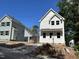 Exterior showing white siding, black roof, and concrete driveway at 908 Colfax St, Durham, NC 27701