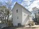 Side angle of a two story home showing rear entry and second story windows at 908 Colfax St, Durham, NC 27701