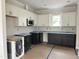 Modern kitchen featuring two-tone cabinets, new appliances, and lots of countertop space at 908 Colfax St, Durham, NC 27701