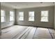 Spacious room, newly painted with three large windows for ample sunlight at 908 Colfax St, Durham, NC 27701