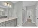 Bathroom features double sink vanity, large mirror, and glass enclosed shower at 9152 Dupree Meadow Dr # 12, Angier, NC 27501